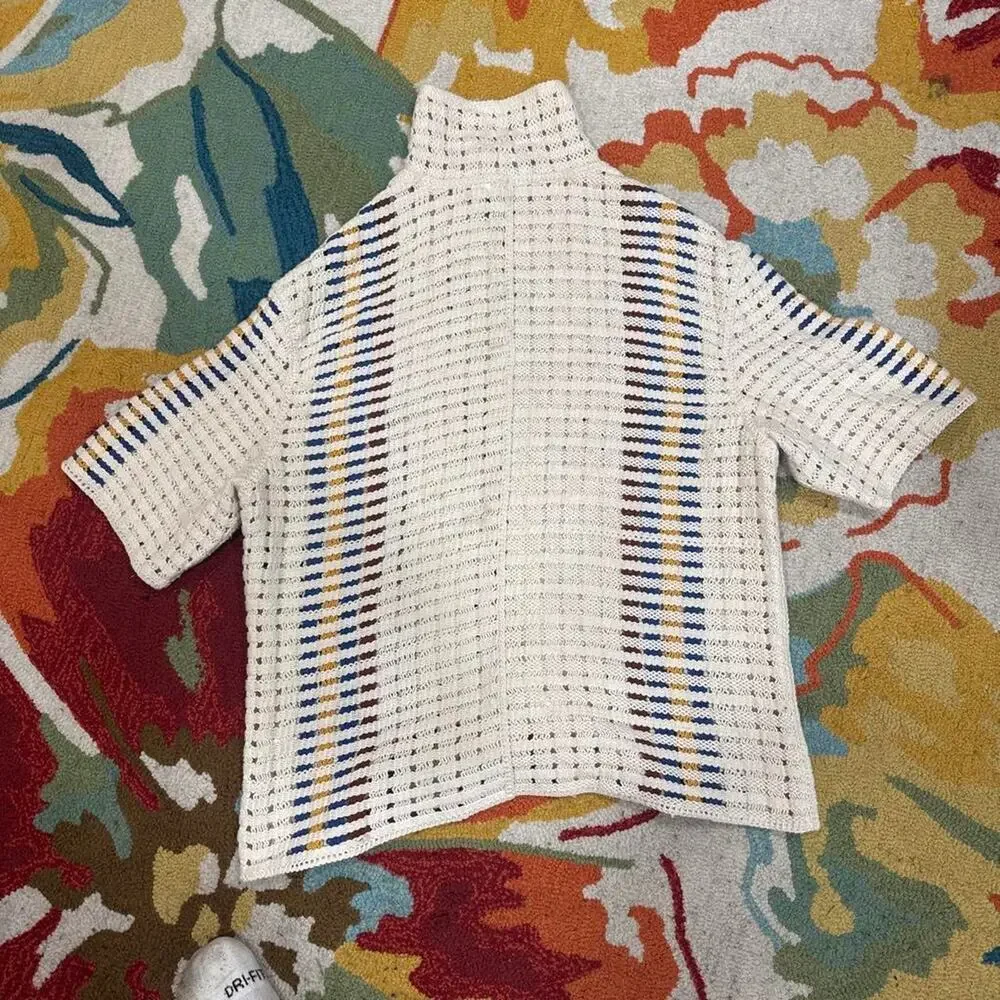White knit button up shirt with